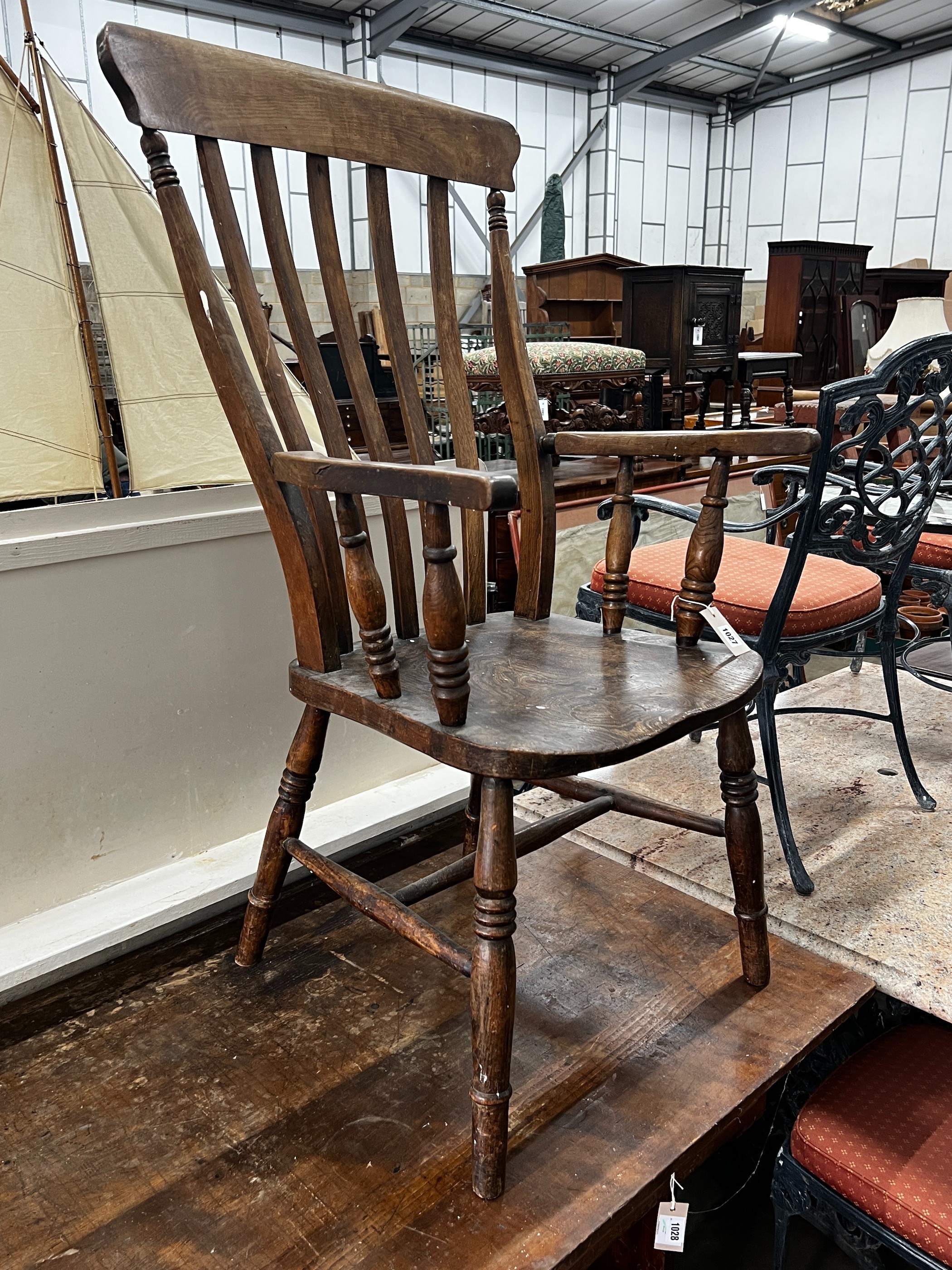 A Victorian elm and beech lathe back armchair, width 55cm, depth 47cm, height 113cm